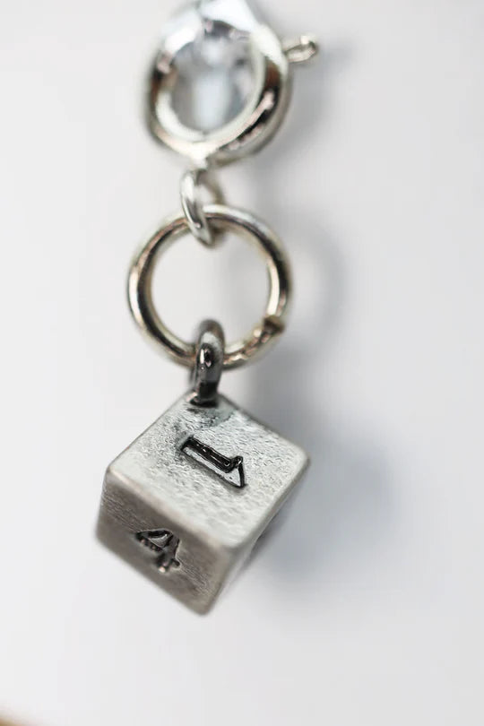 Traveler's Trinkets D6 Charm